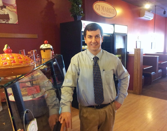 Petoskey GT Pie Co. owner Scott Byrd in his shop on Pi Day, wearing the tie to honor his former math teacher.